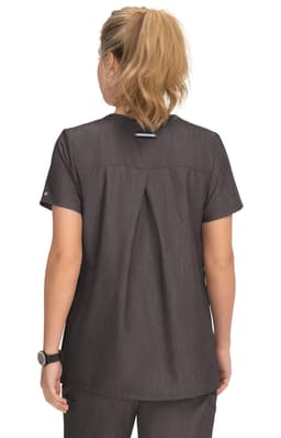 A maternity top in dark grey with a pleated back design, featuring a logo on the sleeve.