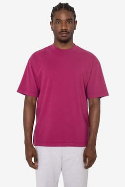A short sleeve crewneck tee in a vibrant magenta colour, featuring a relaxed fit and a logo.