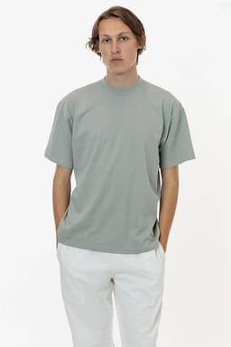 A short sleeve crewneck tee in a soft green colour, featuring a simple design and a logo.