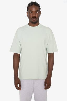 A short sleeve crewneck tee in a soft green colour, featuring a loose fit and a logo.