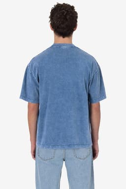 A blue short sleeve crew tee with a mineral wash finish, featuring a casual design and a logo.