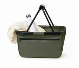 A green shopper bag featuring a silver drink bottle and a light-coloured woven item inside. The bag has a zippered pocket.