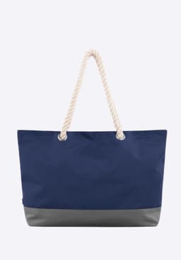 A large navy blue bag with a grey bottom and a rope handle. It features a logo.