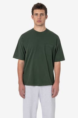 A short sleeve, garment-dyed pocket tee in dark green, featuring a front pocket and a casual fit.