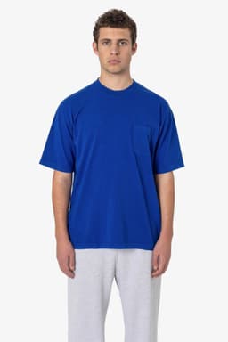 A blue short sleeve garment-dyed pocket tee with a relaxed fit and a front pocket.