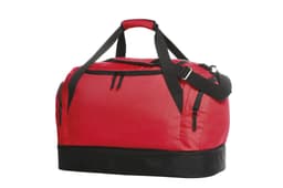A red sports bag with black accents, featuring a top handle, adjustable strap, and multiple zipped compartments.