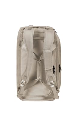 A beige duffle bag with adjustable straps and multiple zippered pockets. It features a logo on the side.