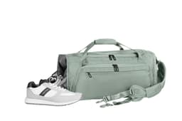 A light green duffle bag with two zippered pockets, accompanied by a pair of white athletic shoes.