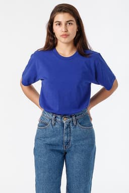 A blue short sleeve fine jersey crew tee displayed on a model, paired with high-waisted jeans.