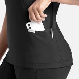 A black banded V-neck top featuring a side pocket holding a phone and a pen. The design is sleek and functional.