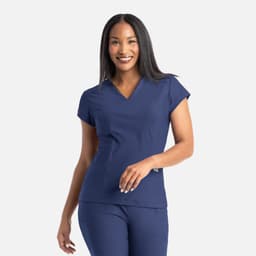 A model wearing a navy blue banded V-neck top, featuring short sleeves and a slim fit. The top has a logo.