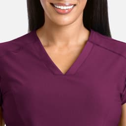 A V-neck top in a rich plum colour, featuring short sleeves and a smooth, comfortable texture.