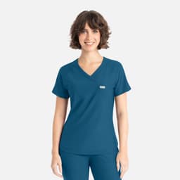 A teal Y-neck top with short sleeves, featuring a branding logo on the front.
