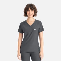 A woman wearing a dark grey Y-neck top with short sleeves, featuring a small logo.