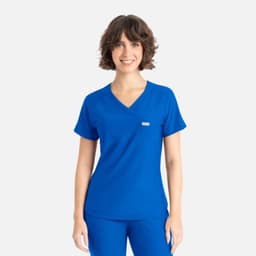 A woman wearing a blue Y-neck top with short sleeves and a small logo on the front.