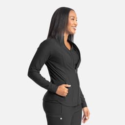 A full zip track jacket in black, featuring a sleek design and a fitted silhouette, worn by a smiling woman.