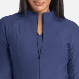 A full zip track jacket in navy blue, featuring a high collar and sleek, fitted design. It has a logo.