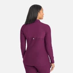 A full zip track jacket in deep plum with a fitted design and a branded logo on the back.