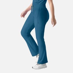 A pair of bootcut pants in teal with an elastic waistband and side pockets, featuring a logo.