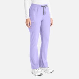A pair of lilac bootcut pants with a drawstring waist and two side pockets. The pants feature a logo on the side.