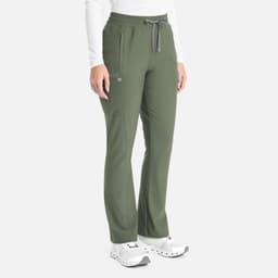 A person wearing olive green bootcut pants with a drawstring waist, side pockets, and white sneakers.