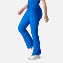 Embrace Nora Bootcut Pant in bright blue, featuring a comfortable fit and a side pocket, presented on a model.
