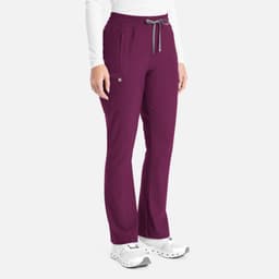 A pair of burgundy bootcut pants featuring an elastic waistband and front pockets, displayed on a model.