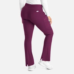 A pair of purple bootcut pants with a snug waistband and a back pocket, featuring a logo.
