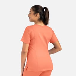 An orange women's double V-neck top, featuring short sleeves and a fitted silhouette, with a visible logo.