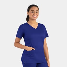 A woman wearing a blue double V-neck top with short sleeves and a front pocket, featuring a logo.