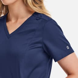 A navy women's double V-neck top with short sleeves and a discreet logo on the sleeve.