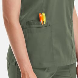 A green Matrix Women's Double V-Neck Top featuring two pens in the side pocket.