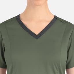 A green women's top featuring a contrast double V-neck design and shoulder buttons, with a logo.