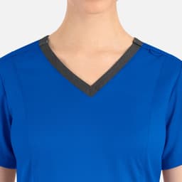 A blue top featuring a contrast double V-neck design with a dark neckline and short sleeves.