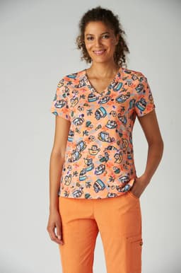 A women's short-sleeved top featuring a vibrant orange colour with artistic prints in blue and white. It has a relaxed fit.