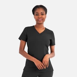 A woman wearing a black, layered V-neck top with short sleeves, featuring a logo.