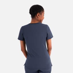A women's layered V-neck top in navy, featuring a fitted design and short sleeves, with a logo on the back.