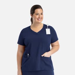 A navy women's layered V-neck top with short sleeves and front pockets, featuring a tag and a logo.
