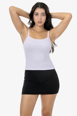 A light purple spaghetti tank top with thin straps, worn with a black mini skirt. It features a logo on the top.
