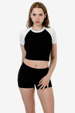 A black and white short sleeve baby rib raglan tee, paired with black shorts, displayed on a model.
