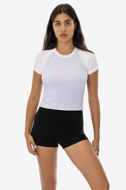 A short sleeve baby rib raglan tee in white, paired with black shorts, featuring a simple design and a logo.