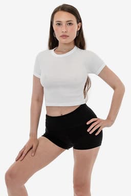 A white short sleeve baby rib raglan tee is displayed on a model wearing black shorts. The shirt has a fitted cut.
