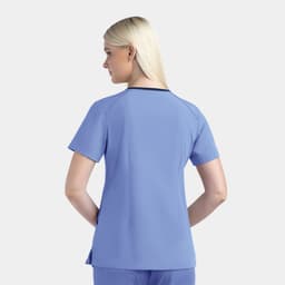 A women's V-neck top in light blue with short sleeves, featuring a contrasting neckline and a slight tail.