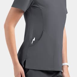 A women's dark grey V-neck top featuring side pockets and a casual fit. Includes branding on the design.