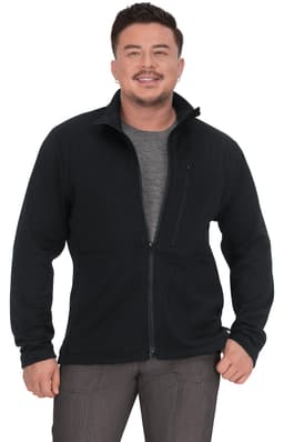 A man wearing a black jacket with a zip, featuring a grey shirt underneath and a pocket on the left side.