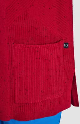 A red knitted sweater featuring a pocket and a brand logo. The texture includes speckles for added detail.