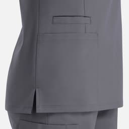 A grey women's top featuring a double V-neck design and side pockets, with a logo on the fabric.