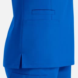 A vibrant blue women's top featuring a double V-neck and a side pocket. The fabric has a smooth finish.