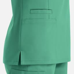 A women's double V-neck top in teal, featuring a side slit and a pocket detail.