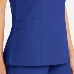 A blue women's mock wrap top featuring two side pockets and a logo on the fabric.